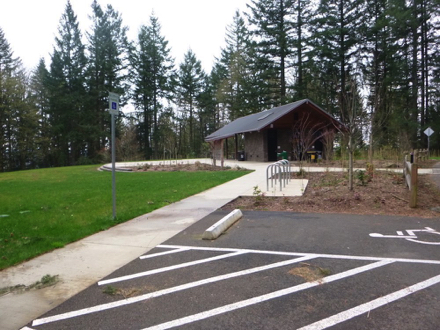 Parking spaces, two accessible – bike rack, accessible restrooms – shelter with picnic tables